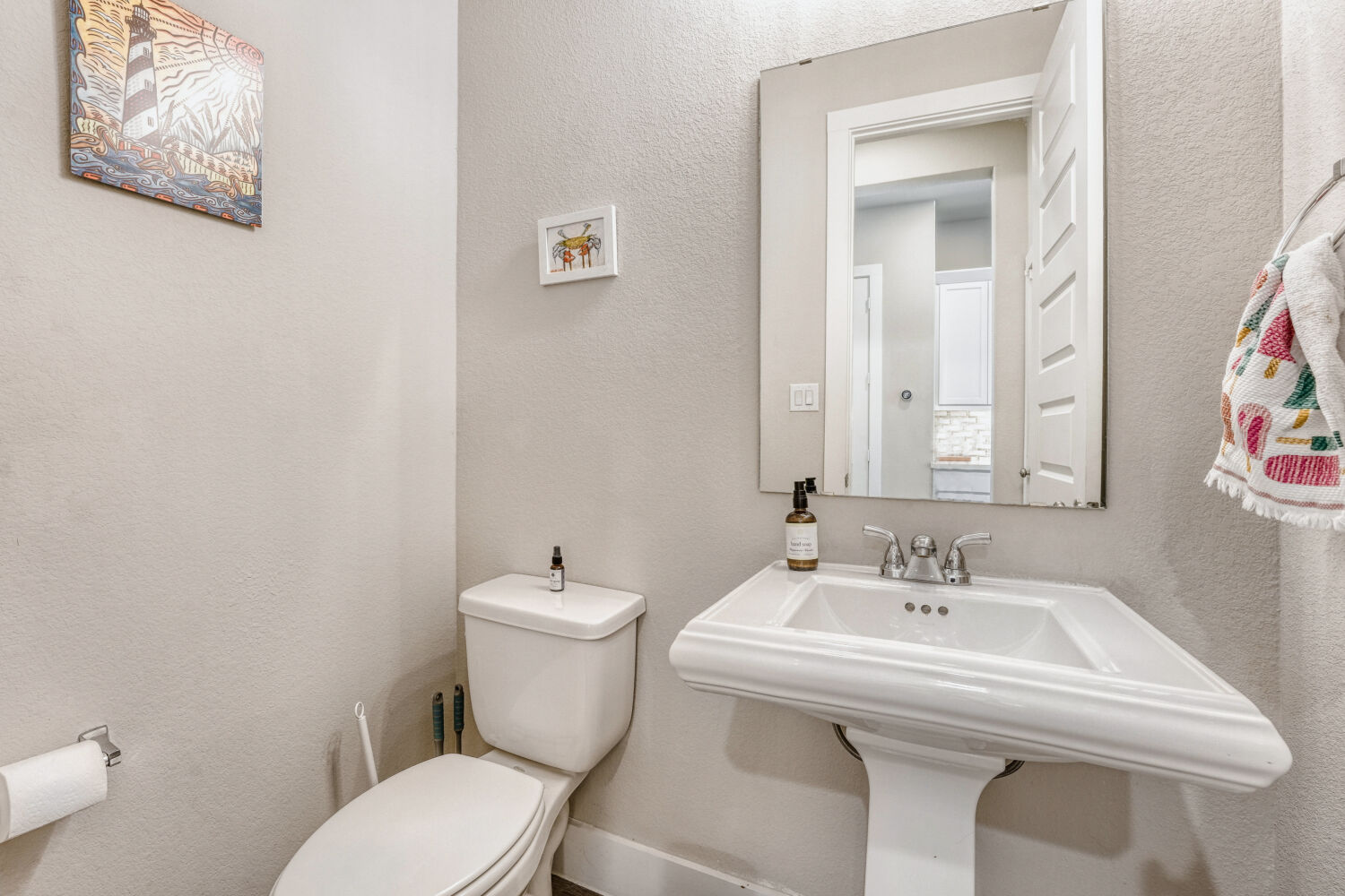 505 Trout River Road Kyle, TX 78640 - Photo 23 of 29 Half bathroom with a textured wall and toilet