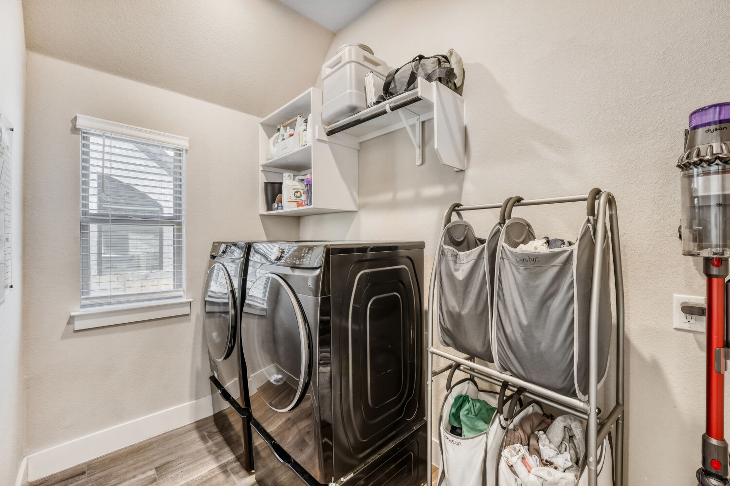 505 Trout River Road Kyle, TX 78640 - Photo 24 of 29 Laundry area featuring light wood-style flooring and separate washer and dryer