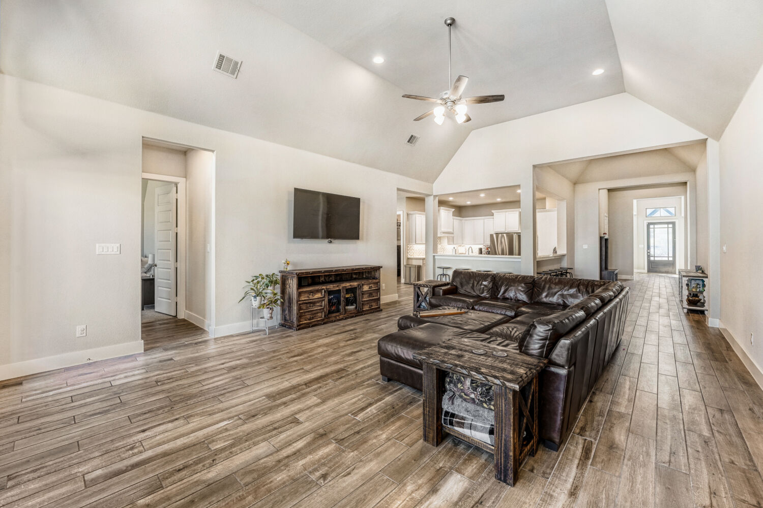 505 Trout River Road Kyle, TX 78640 - Photo 3 of 29 Living room with ceiling fan, recessed lighting, and wood finished floors
