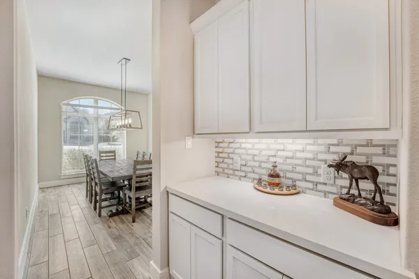 a kitchen with a sink and cabinets