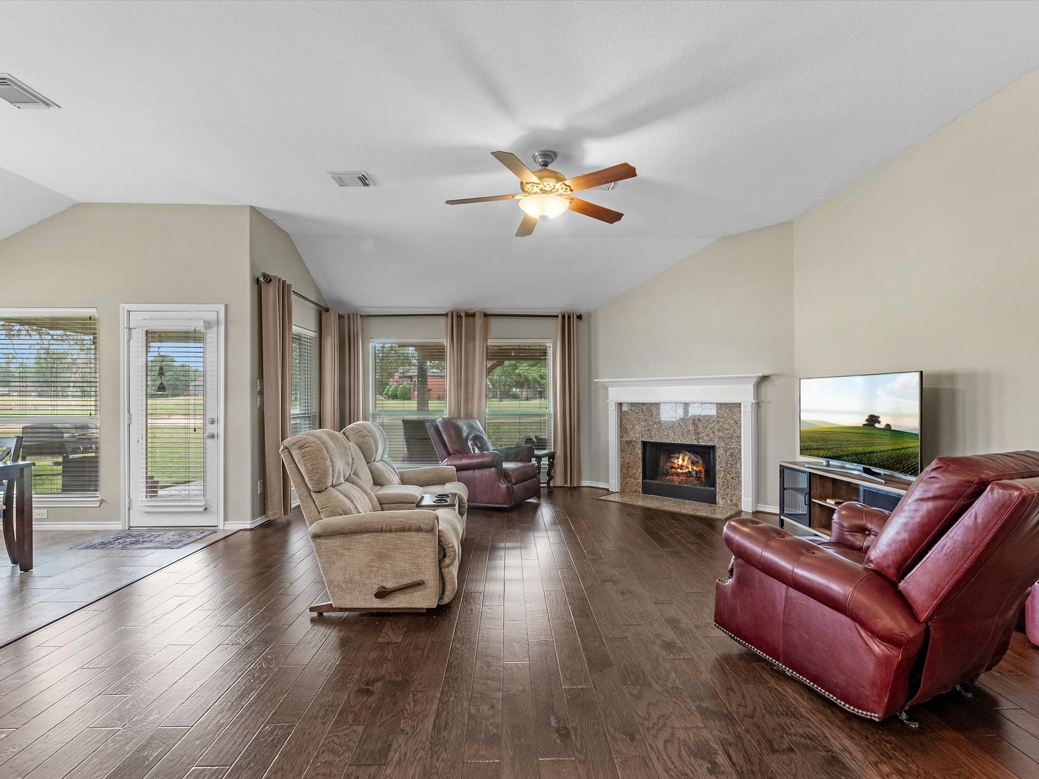 19019 Relay Road Humble, TX 77346 - Photo 8 of 31 a living room with fireplace furniture and a wooden floor