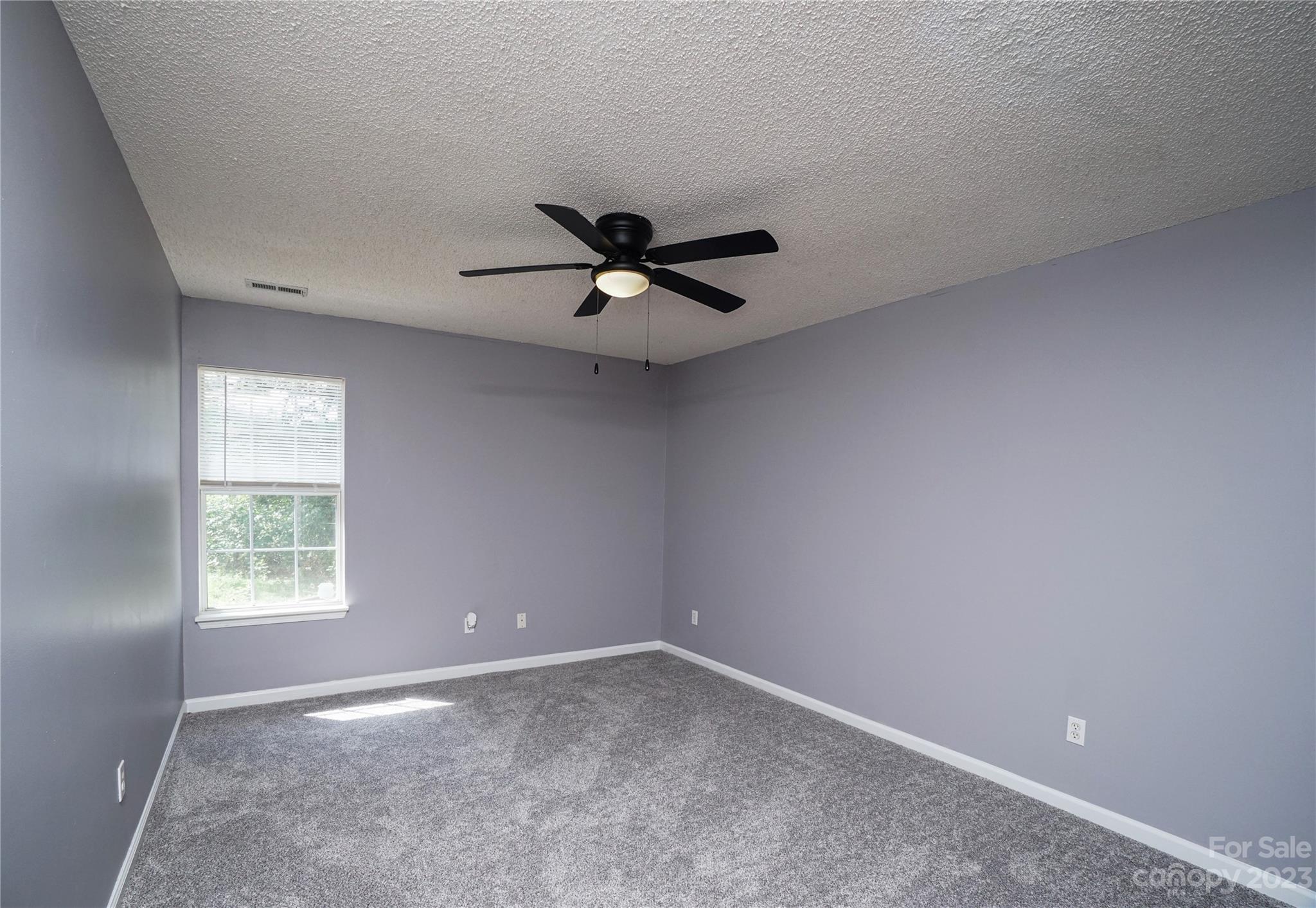 520 Jacobs Ridge Fort Mill, SC 29715 - Photo 16 of 33 an empty room with a window and a ceiling fan