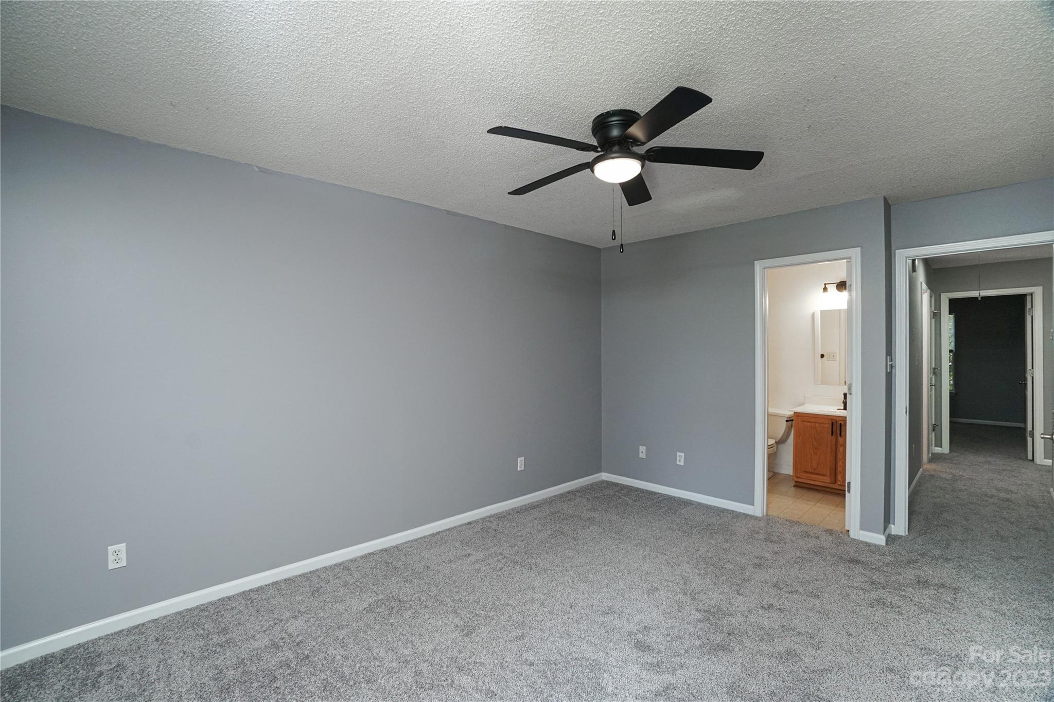 520 Jacobs Ridge Fort Mill, SC 29715 - Photo 19 of 33 an empty room with closet and a ceiling fan