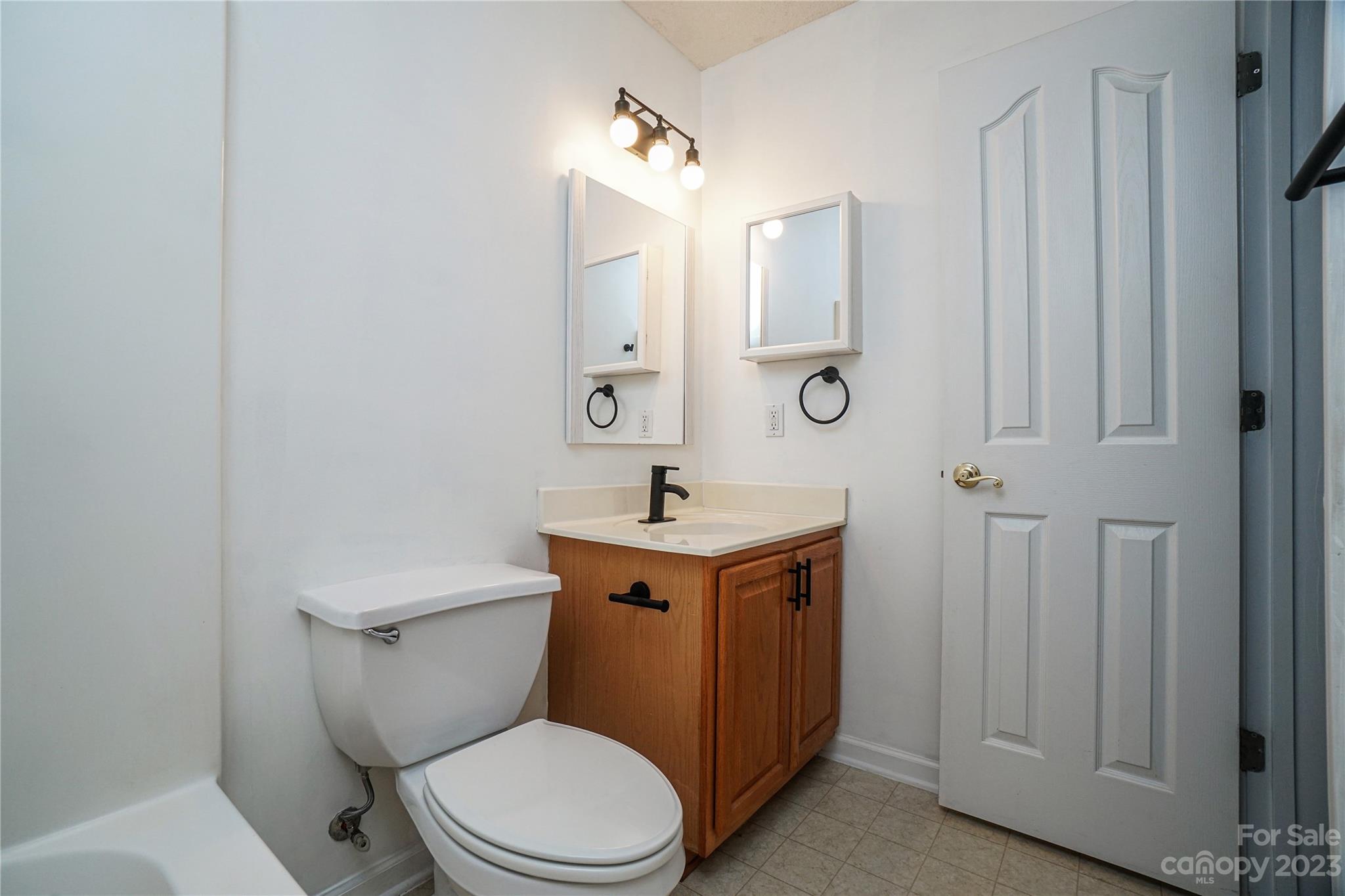 520 Jacobs Ridge Fort Mill, SC 29715 - Photo 21 of 33 a bathroom with a sink a toilet a mirror and shower