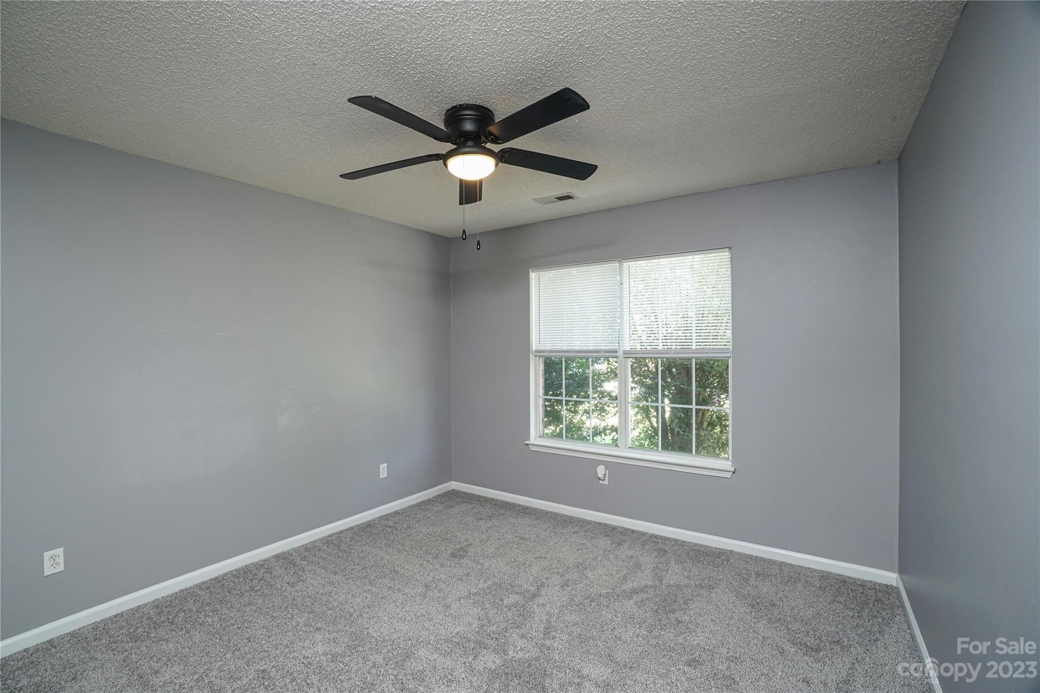520 Jacobs Ridge Fort Mill, SC 29715 - Photo 23 of 33 an empty room with a window and a fan