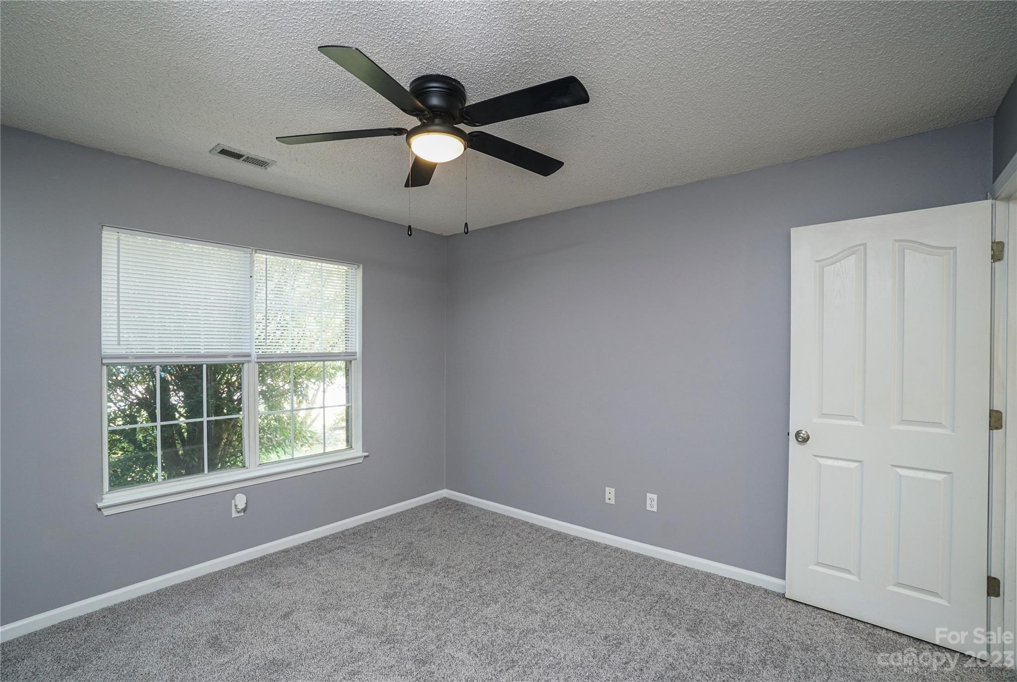 520 Jacobs Ridge Fort Mill, SC 29715 - Photo 26 of 33 an empty room with windows and fan