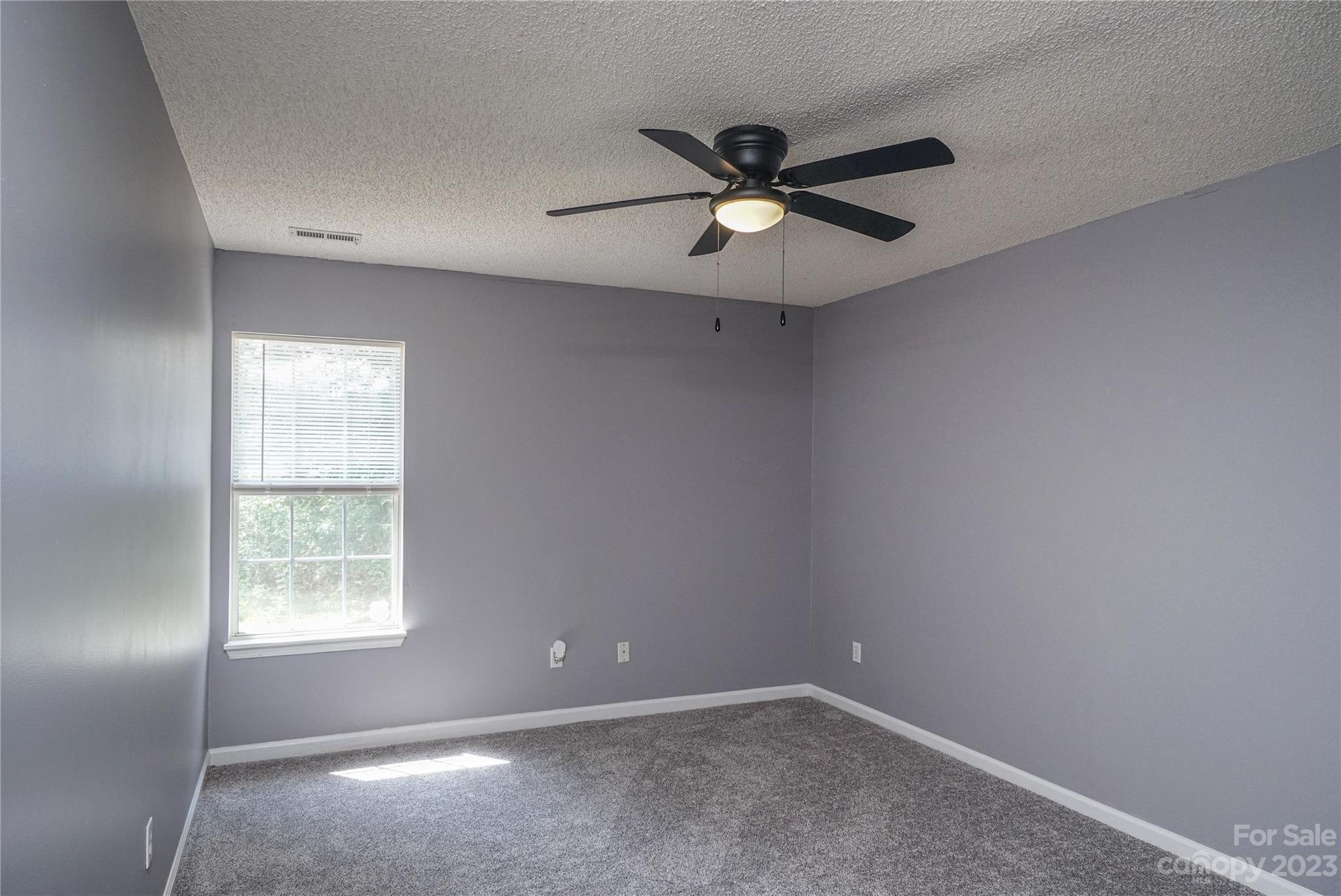 520 Jacobs Ridge Fort Mill, SC 29715 - Photo 31 of 33 an empty room with a window and a fan