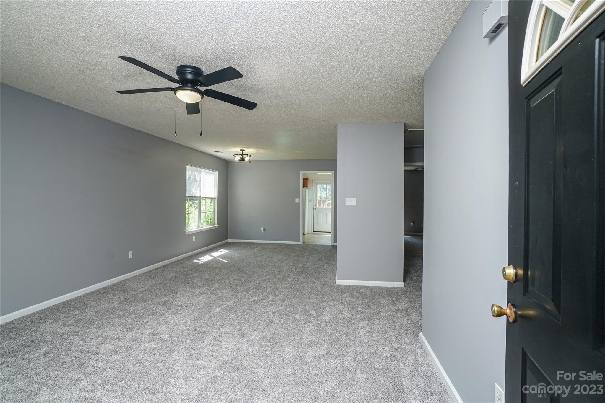 520 Jacobs Ridge Fort Mill, SC 29715 - Photo 7 of 33 a view of a livingroom with a ceiling fan and window