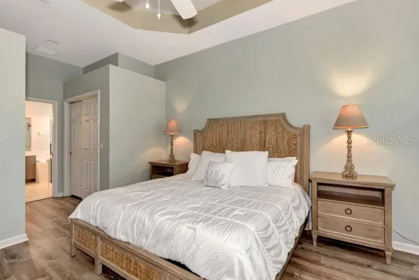 a bedroom with a bed and a lamp