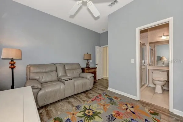 a living room with a bed and furniture