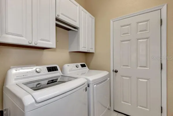 a utility room with dryer and washer