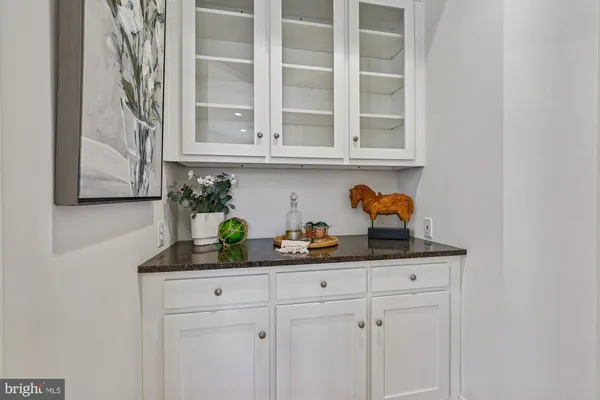 a kitchen with a table and chairs