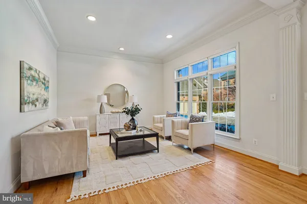 a view of a dining room with furniture wooden floor and chandelier