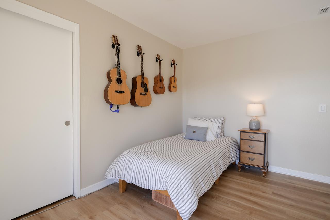 155 Rabbits Run Road Santa Cruz, CA 95060 - Photo 82 of 113 a bedroom with a bed and painting on the wall