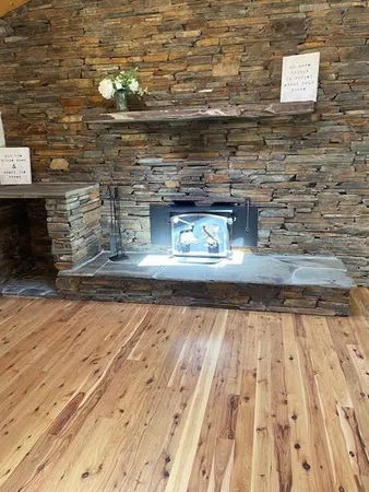 a bathroom with a wooden floor