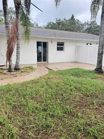 a house view with a backyard space