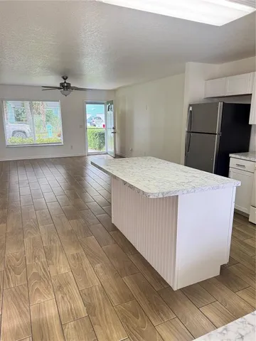 wooden floor in an empty room with window and wooden floor