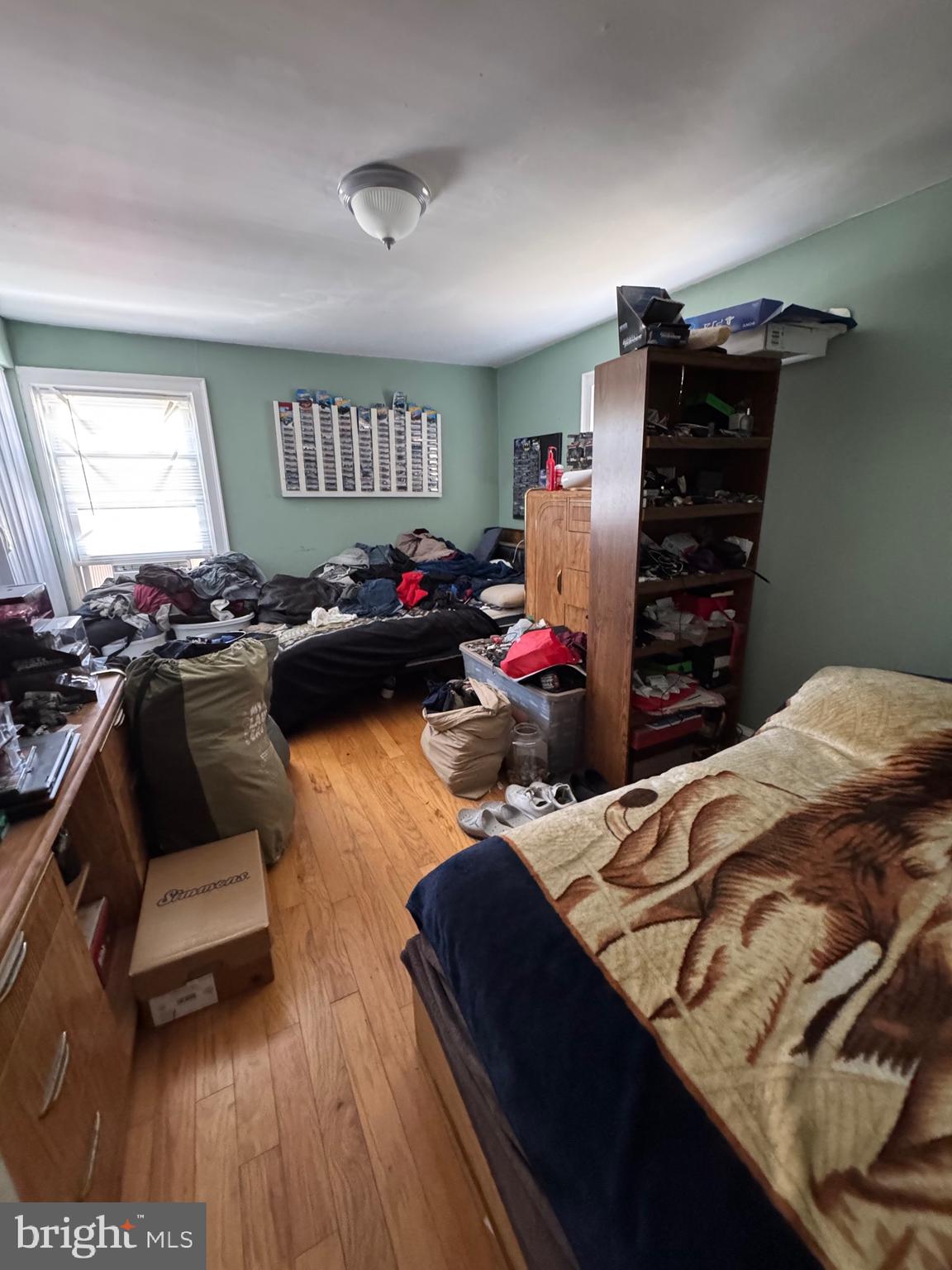1515 Collings Road Camden, NJ 08104 - Photo 15 of 23 a bedroom with a bed and a couch