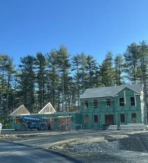 a view of house with yard