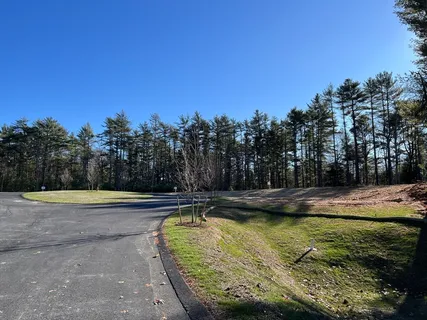 a view of a swimming pool with an outdoor space and seating area