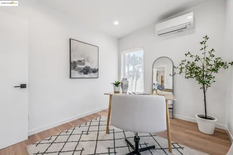 a bed sitting in a bedroom next to a window