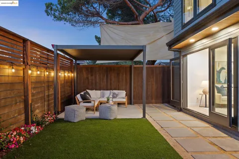 a outdoor living space with patio furniture and a potted plant