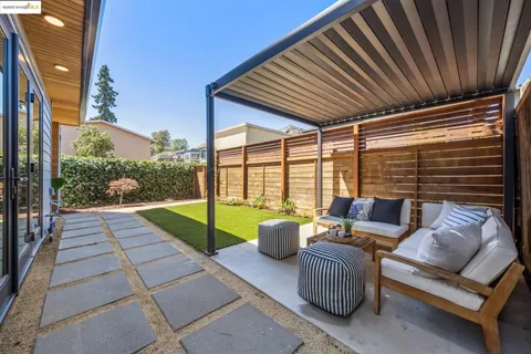 a view of a patio with couches chairs dining table and chairs