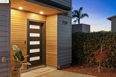 a living room with furniture and a mirror