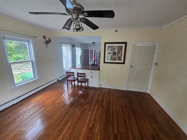 a view of livingroom with hardwood floor and ceiling fan