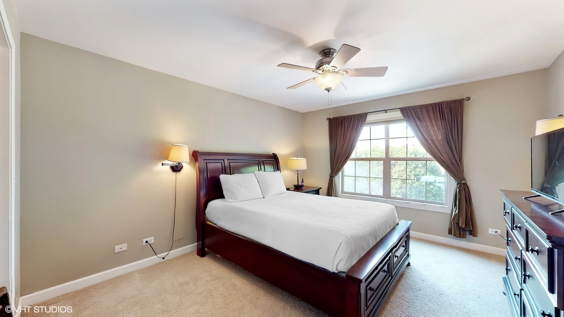 11415 Sisters Court, Unit 11415 Huntley, IL 60142 - Photo 16 of 32 a bedroom with a bed and a tv on the dresser