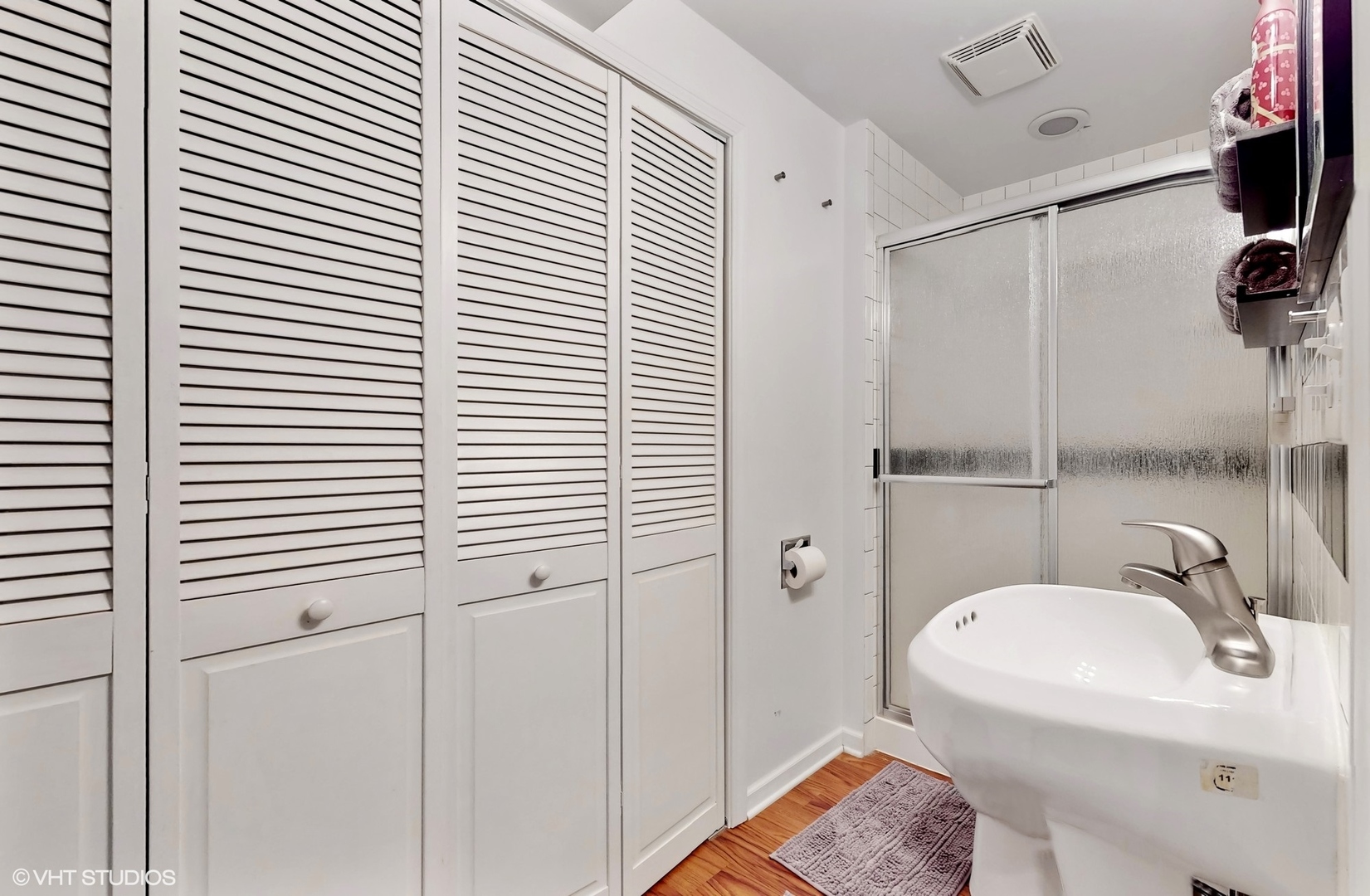 11415 Sisters Court, Unit 11415 Huntley, IL 60142 - Photo 21 of 32 a bathroom with a sink and shower