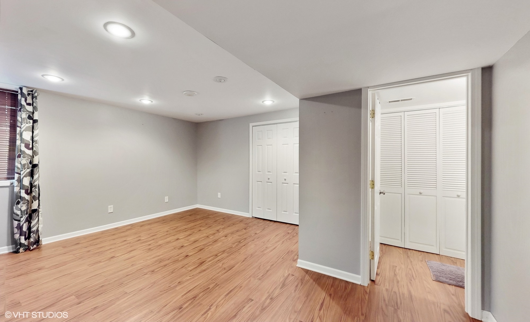 11415 Sisters Court, Unit 11415 Huntley, IL 60142 - Photo 22 of 32 an empty room with wooden floor & windows