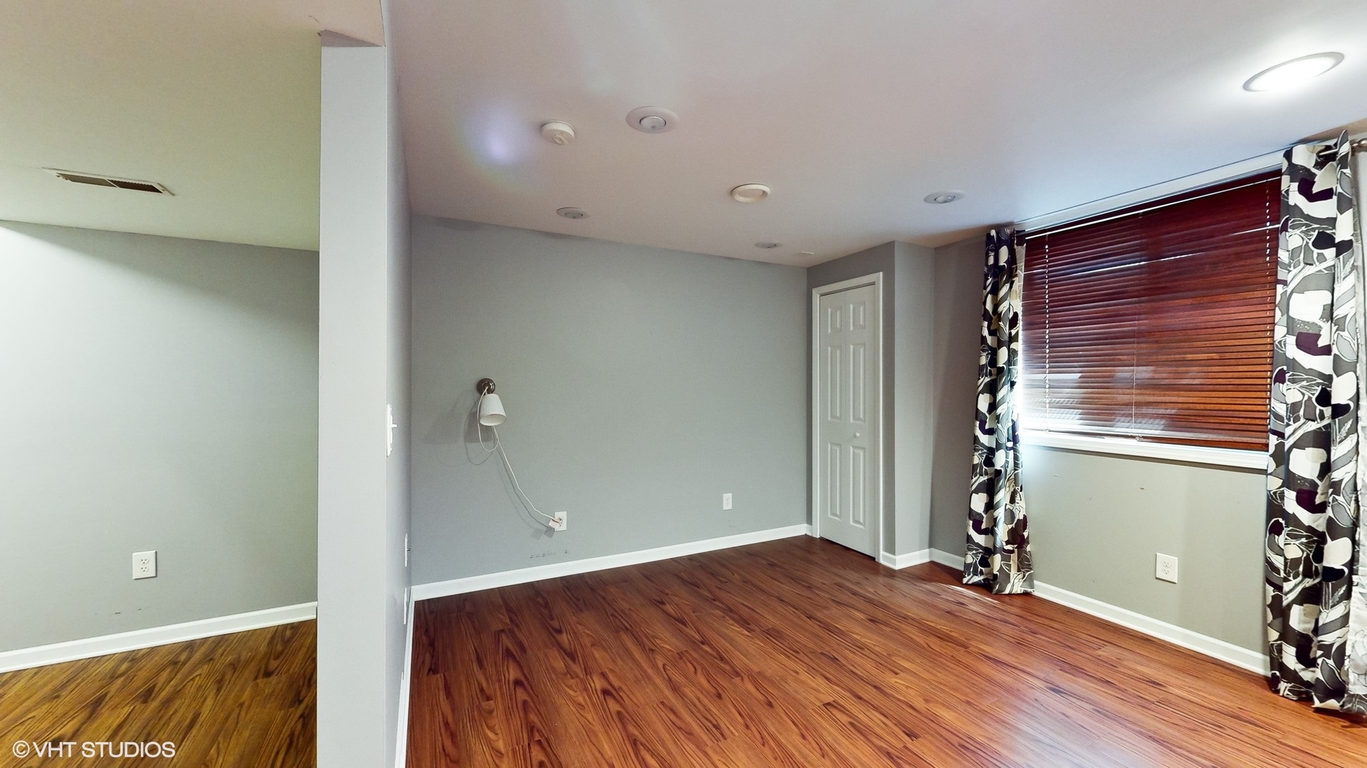 11415 Sisters Court, Unit 11415 Huntley, IL 60142 - Photo 24 of 32 a view of empty room with wooden floor