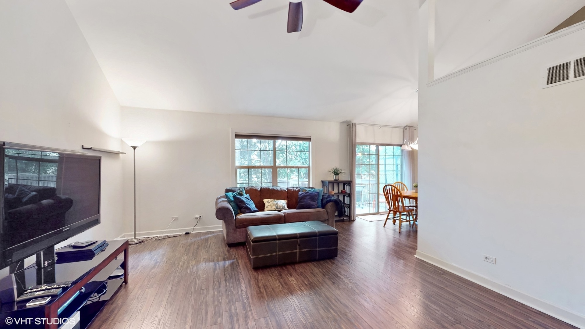 11415 Sisters Court, Unit 11415 Huntley, IL 60142 - Photo 4 of 32 a living room with furniture and a flat screen tv