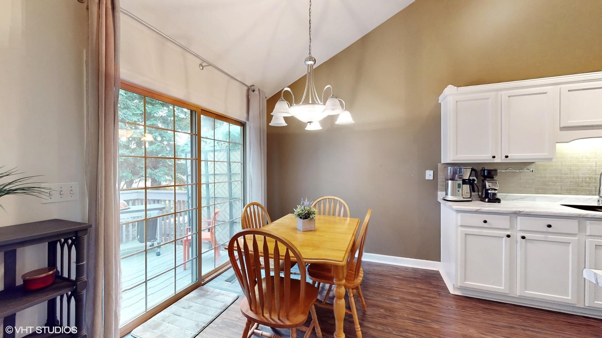 11415 Sisters Court, Unit 11415 Huntley, IL 60142 - Photo 8 of 32 a view of a dining room with furniture and a window