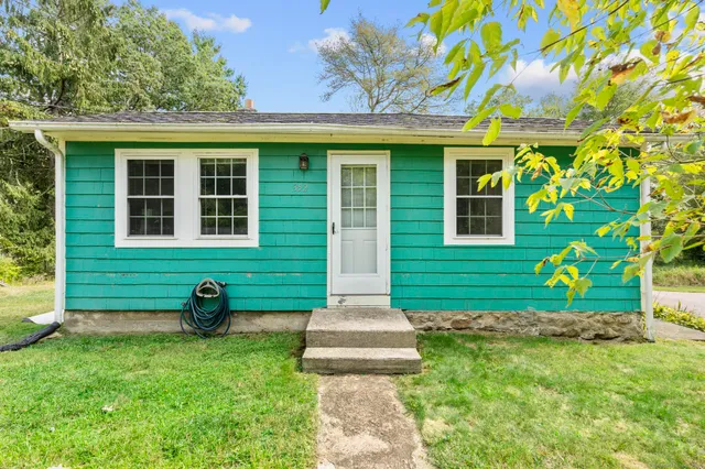 a front view of a house with garden