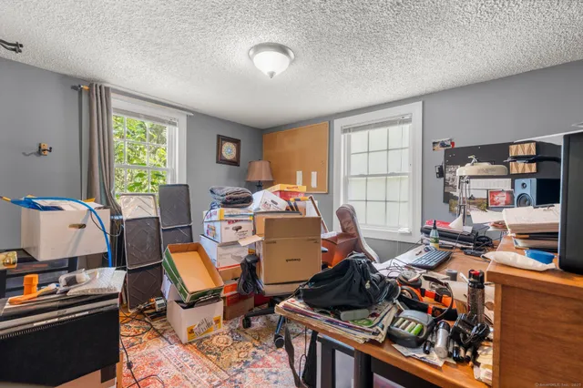 a room with workspace and a window