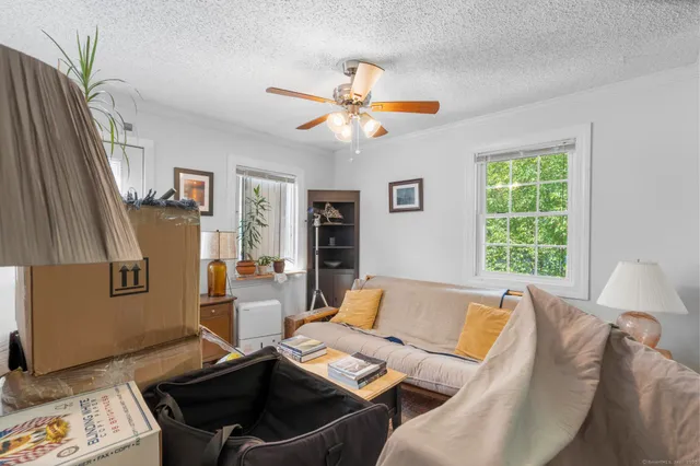 a living room with furniture and a window