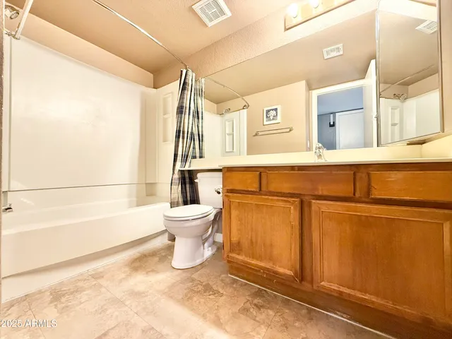 a bathroom with a sink a toilet and bathtub
