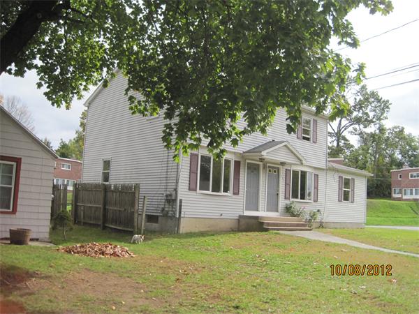 149-151 Darling Street Springfield, MA 01151 - Photo 3 of 8 a front view of a house with a yard