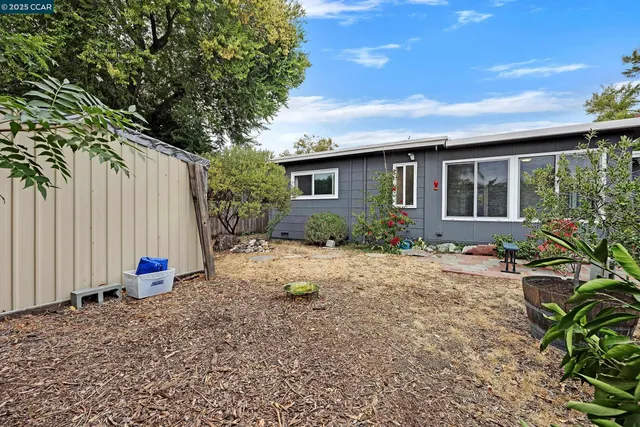 a backyard of a house with lots of green space