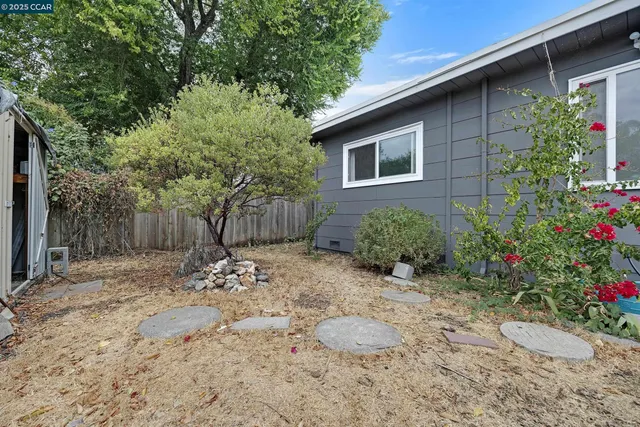 a view of a house with a tree