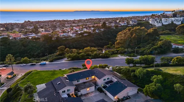 a living room with furniture a large window and a dining table with garden view
