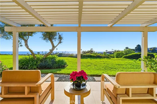 a living room with furniture kitchen and a chandelier