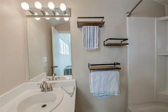 a bathroom with a sink and a mirror