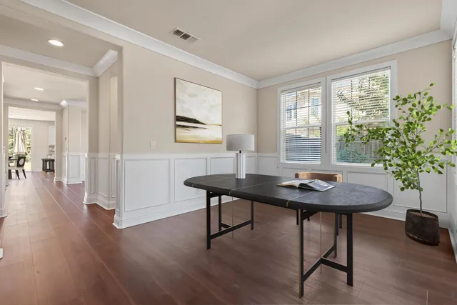 a view of a workspace with furniture and a potted plant