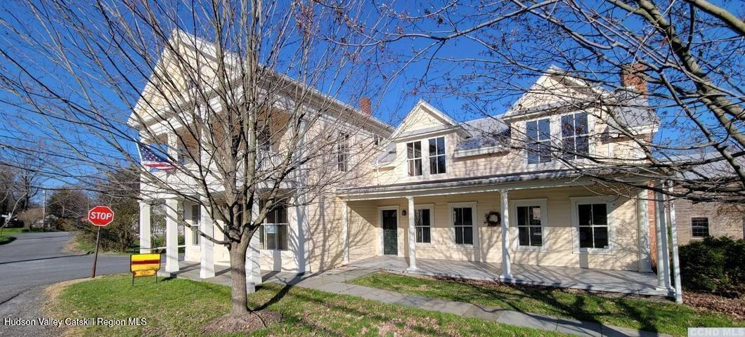 2948 County Rte 9 East Chatham, NY 12060 - Photo 1 of 32 a front view of a house with a yard table and chairs