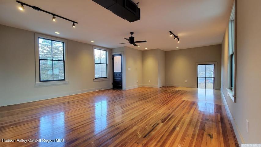 2948 County Rte 9 East Chatham, NY 12060 - Photo 22 of 32 a view of an empty room with window and wooden floor