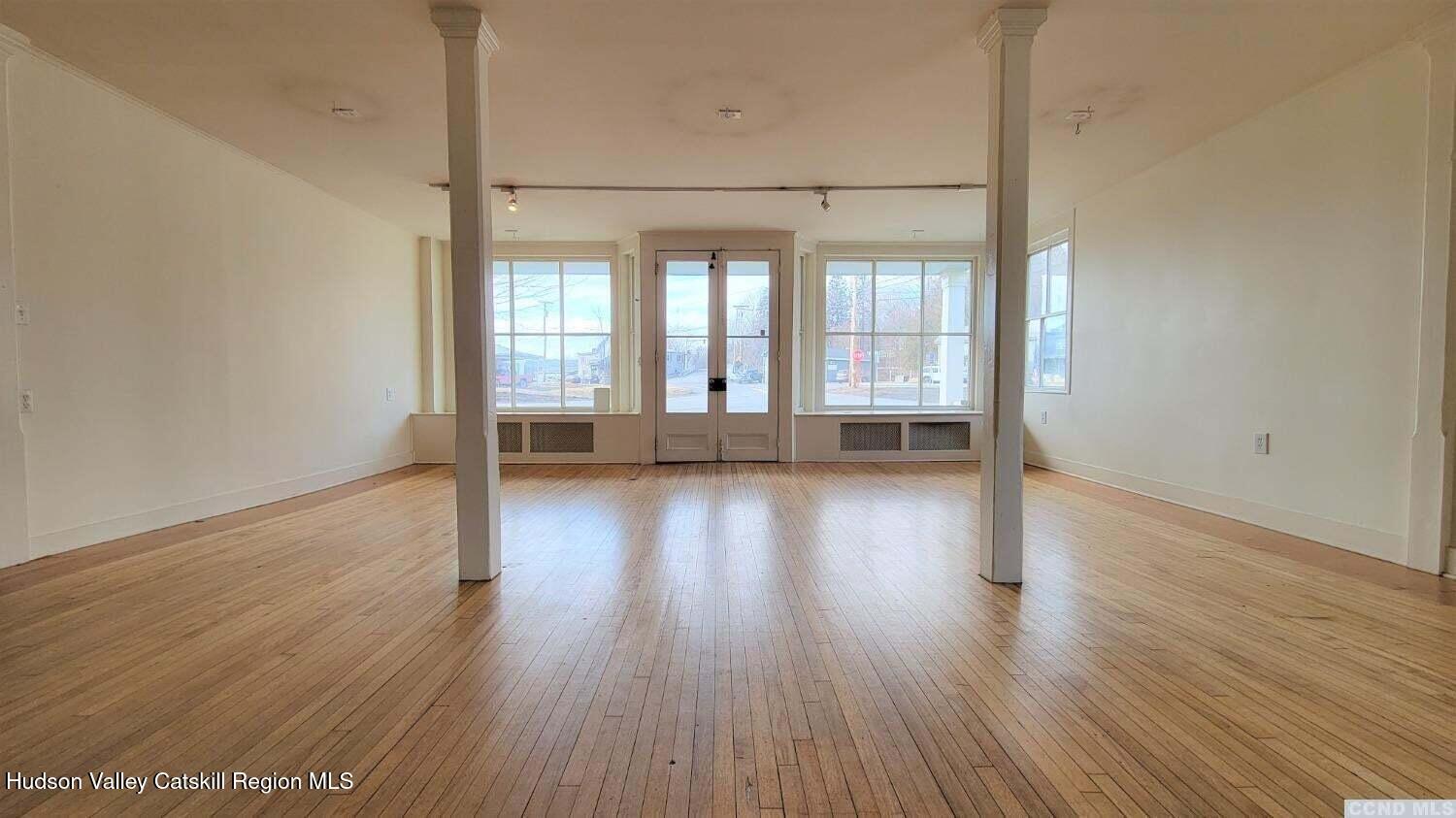 2948 County Rte 9 East Chatham, NY 12060 - Photo 6 of 32 an empty room with wooden floor and windows