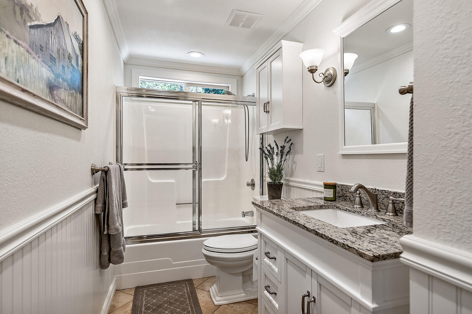 1011 Upper Applegate Road Jacksonville, OR 97530 - Photo 26 of 49 a bathroom with a granite countertop sink toilet a mirror a vanity and shower